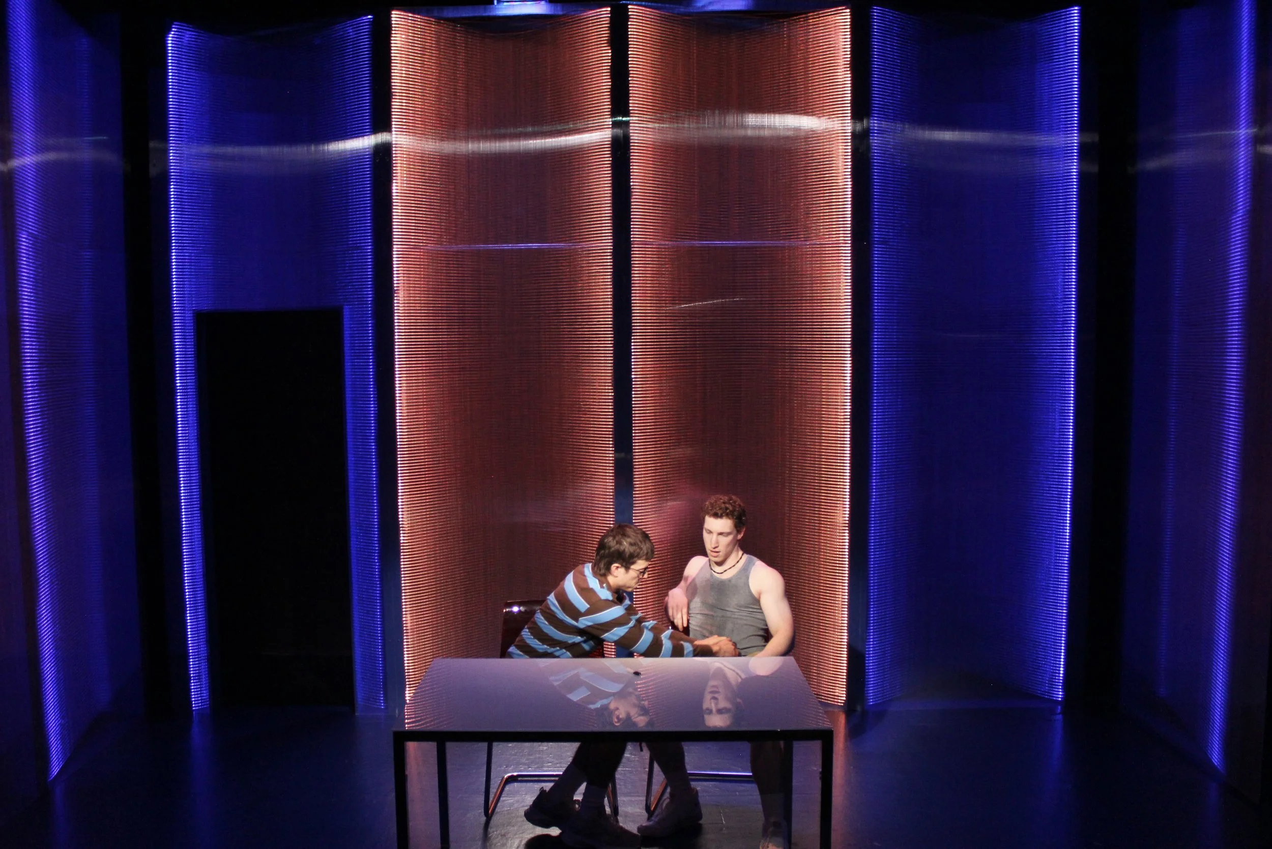   Nicholas Renee Rodriguez, Matt Skinner.   Scenic Design by Maya Linke  Lighting and Projection Design by Spense Matubang  Costume Design by Alice Ruiz  Sound Design by Chris Sauceda  Photograph by Samuel del Rosario 