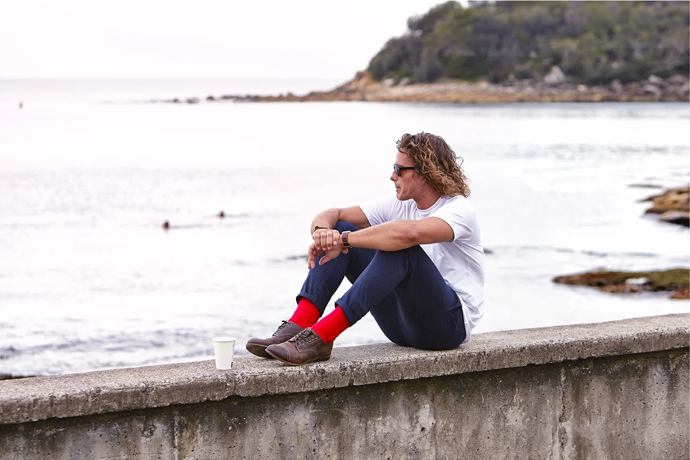 Weekender Tee and Journeyman Socks by Fare Well Co . Navy Travel Longs by Smile Clothing . Gatsby Sunglasses by Oscar Wylee .