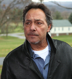 Dick (Bob Romanus) is part of UOPS. Unusual Occurrence and Paranormal Society. NY state chapter. Dick is here with his wife Dot, to investigate a report of UFO activity in the South Mountain area. He is staying at the Penn National Inn and Golf Club on 997. (Route 30, Mojave Phone Booth, Fast Times At Ridgemont High)