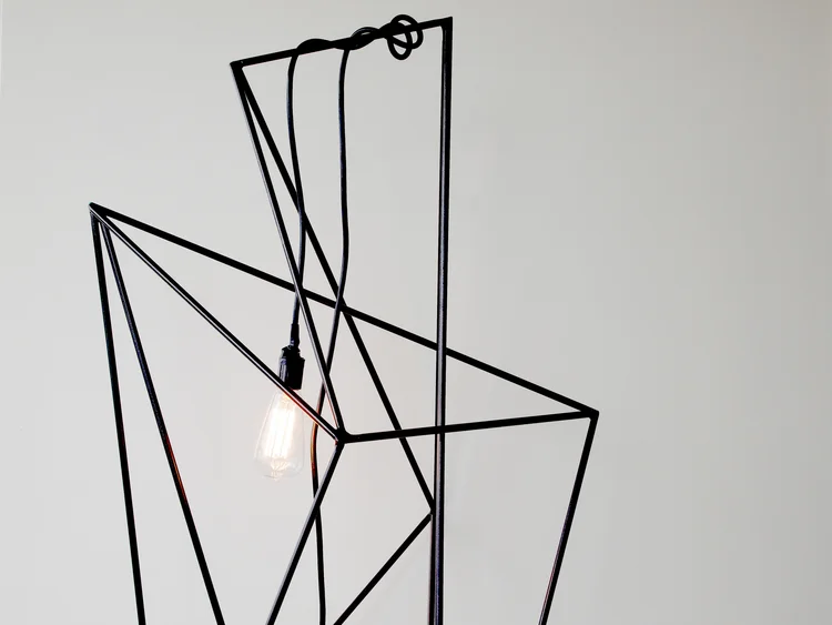 Lit energy dangles adding to the tight tension in the piece. 