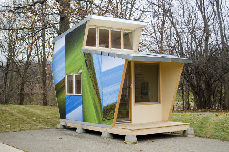 The 80 square foot multi-storied dwelling is wrapped in weatherproof recycled billboard. When speaking with members of the homeless community, safety was their most important concern. Lofting the bed became Outlook’s defining feature.