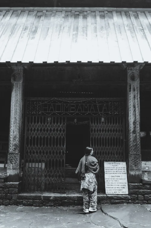 A woman stands at the entrance