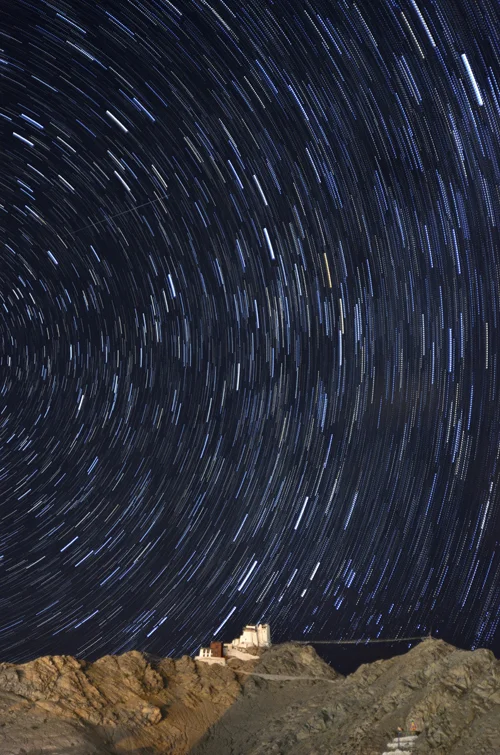 Star trails behind Tsemo Gompa