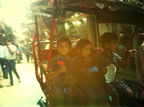 School kiddies in a cycle rickshaw