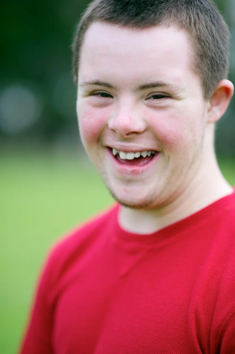 20111212-sixteen-year-old boy with red shirt, smiling at camera.jpg