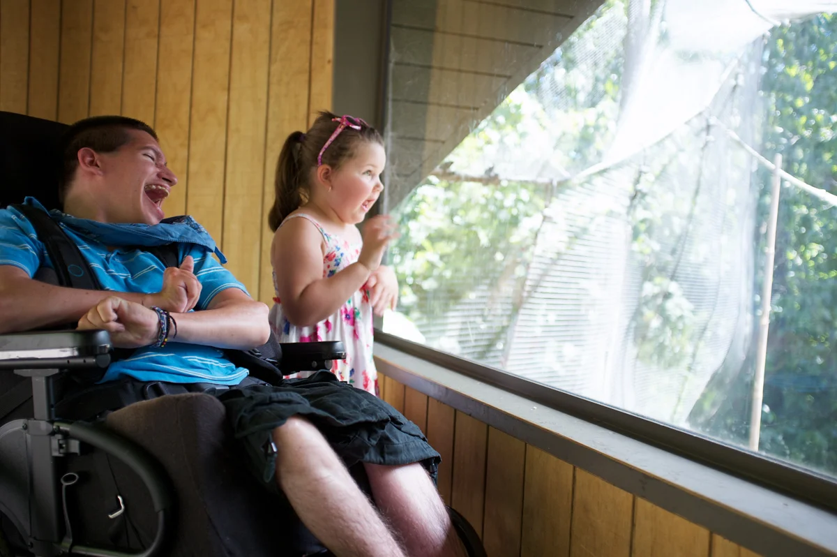 20120117-little girl and young man in a wheelchair looking out a window.jpg