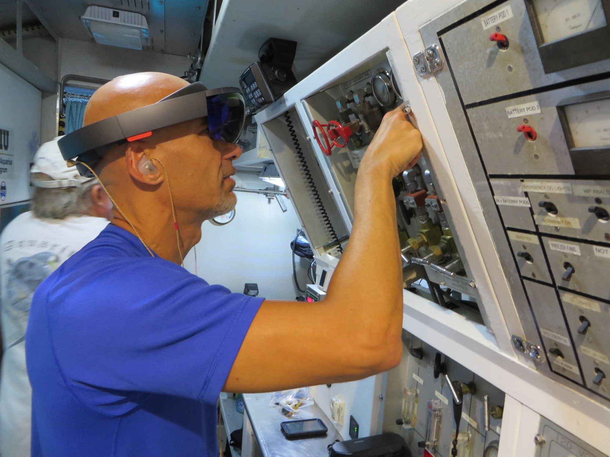 Astronaut Luca Parmitano using HoloLens during a complicated maintenance task in the Aquarius Reef Base, about 3 miles off the cost of Florida and 60 feet underwater.