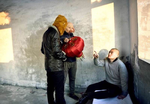 “Discussing where to hang the lantern”. While the artist goes to great length to reproduce the feel and mood of Hopper’s painting, he instills his own character in the pieces and takes liberties with the rigid compositions of the paintings. The result is a clear correspondence between both pieces, with each being a statement of its own. The masks, minimalistic approach to evoking fantastical protagonists, keep the photographs from straying too far on the surreal side.
