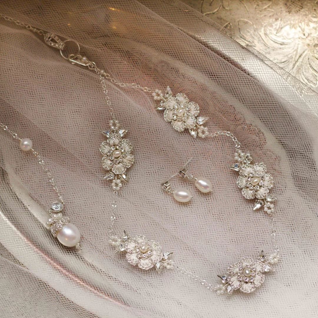 I loved creating this custom order for a lovely bride-to-be! Based on the Hyacinthe Choker style, this delicate set features a silver lace necklace embroidered by hand with ivory silk threads and vintage crystals. Tiny freshwater seed pearls and leaf
