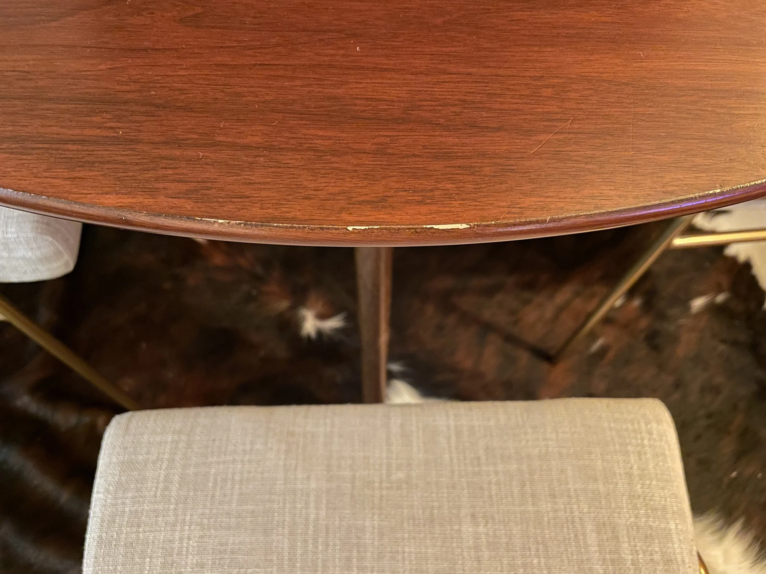  Close-up of minor scuff on one side of table. Real talk: I’ve used wood cover-up markers on stuff like this, and they’re clutch!  