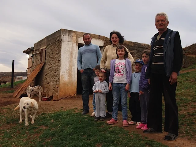 The Dimic family in front of their stable
