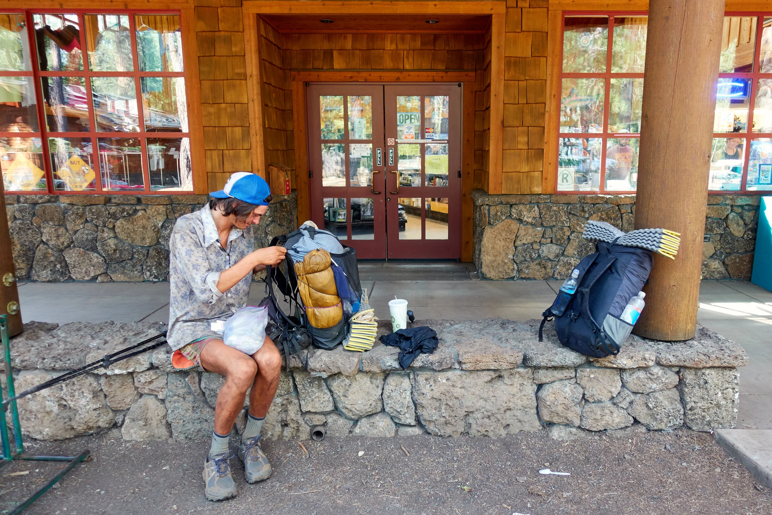 Sam fixing the load-lifters of his ZPacks backpack. Again.