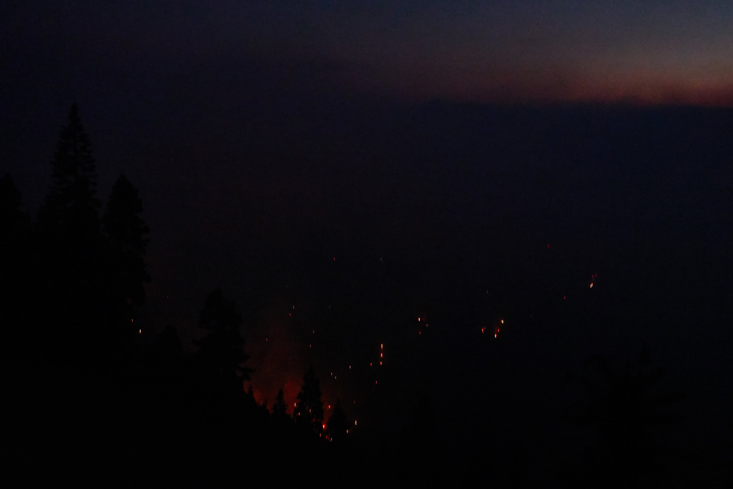 Watching the fire down below from the trail.