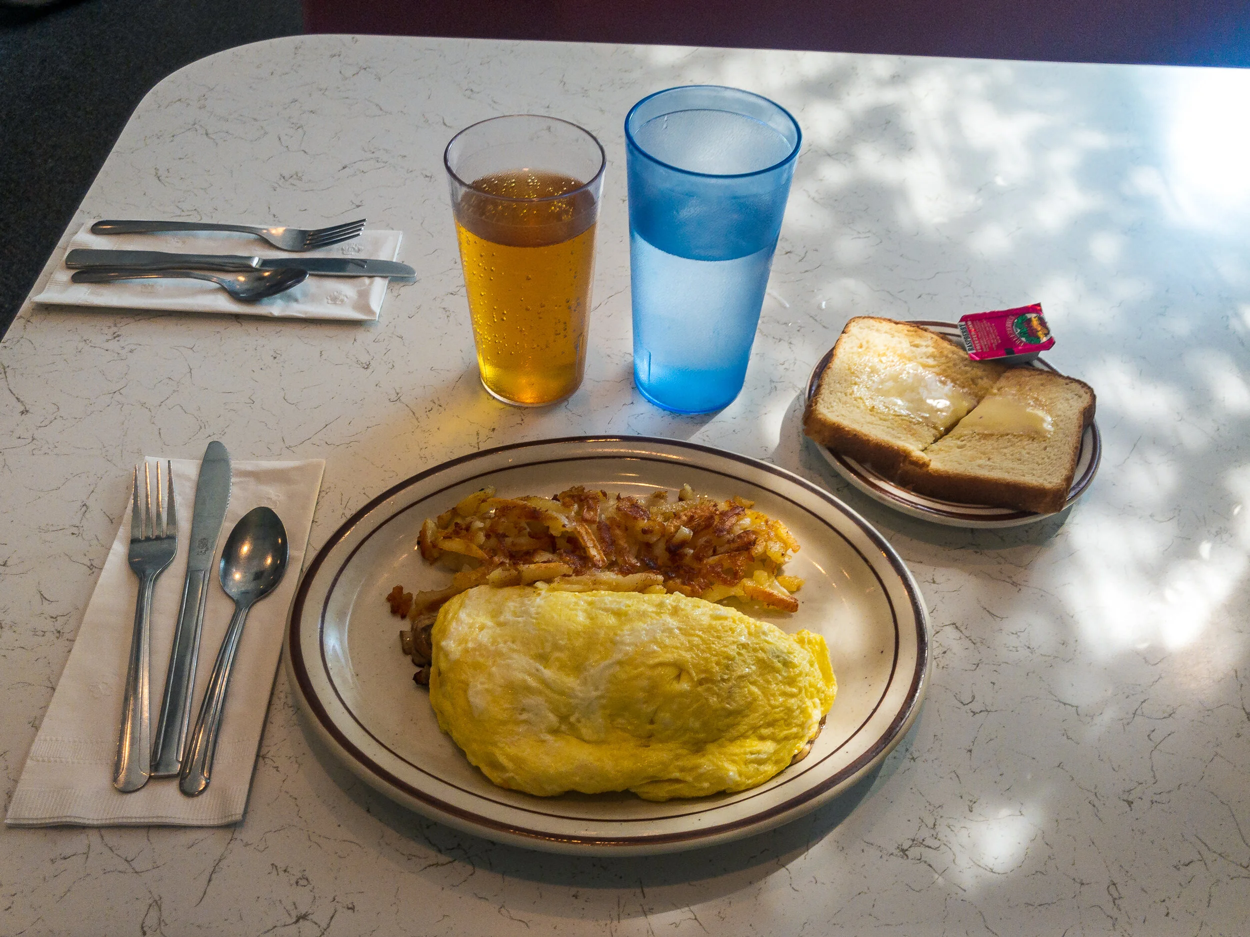 Having breakfast alone.