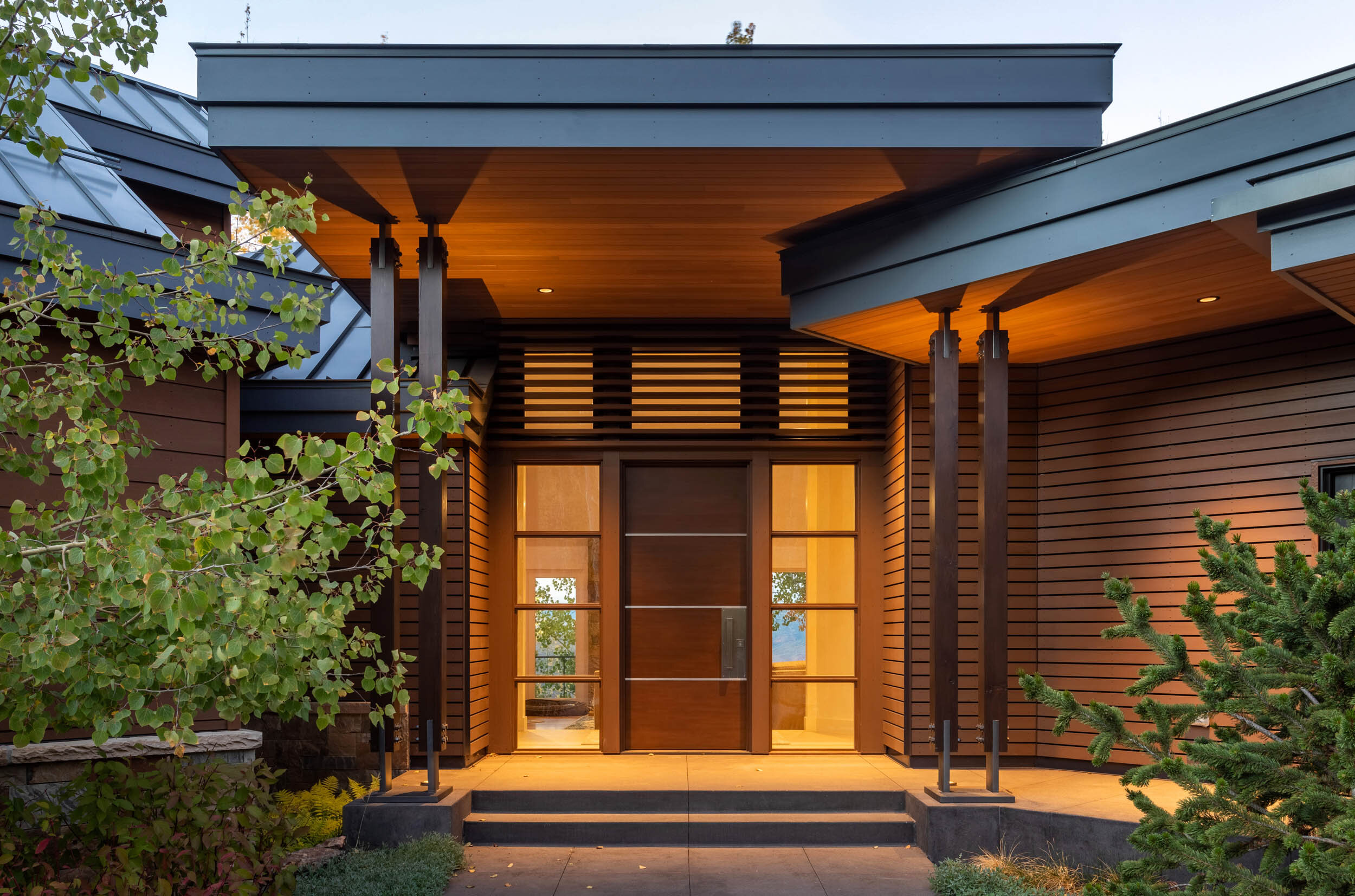 Expressive knife plate connections flank your entry as you travel the heated walk.