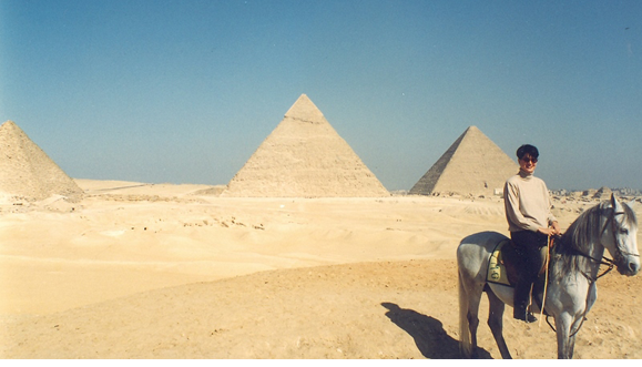 When I lived in Cairo I liked riding horseback near the
pyramids.
