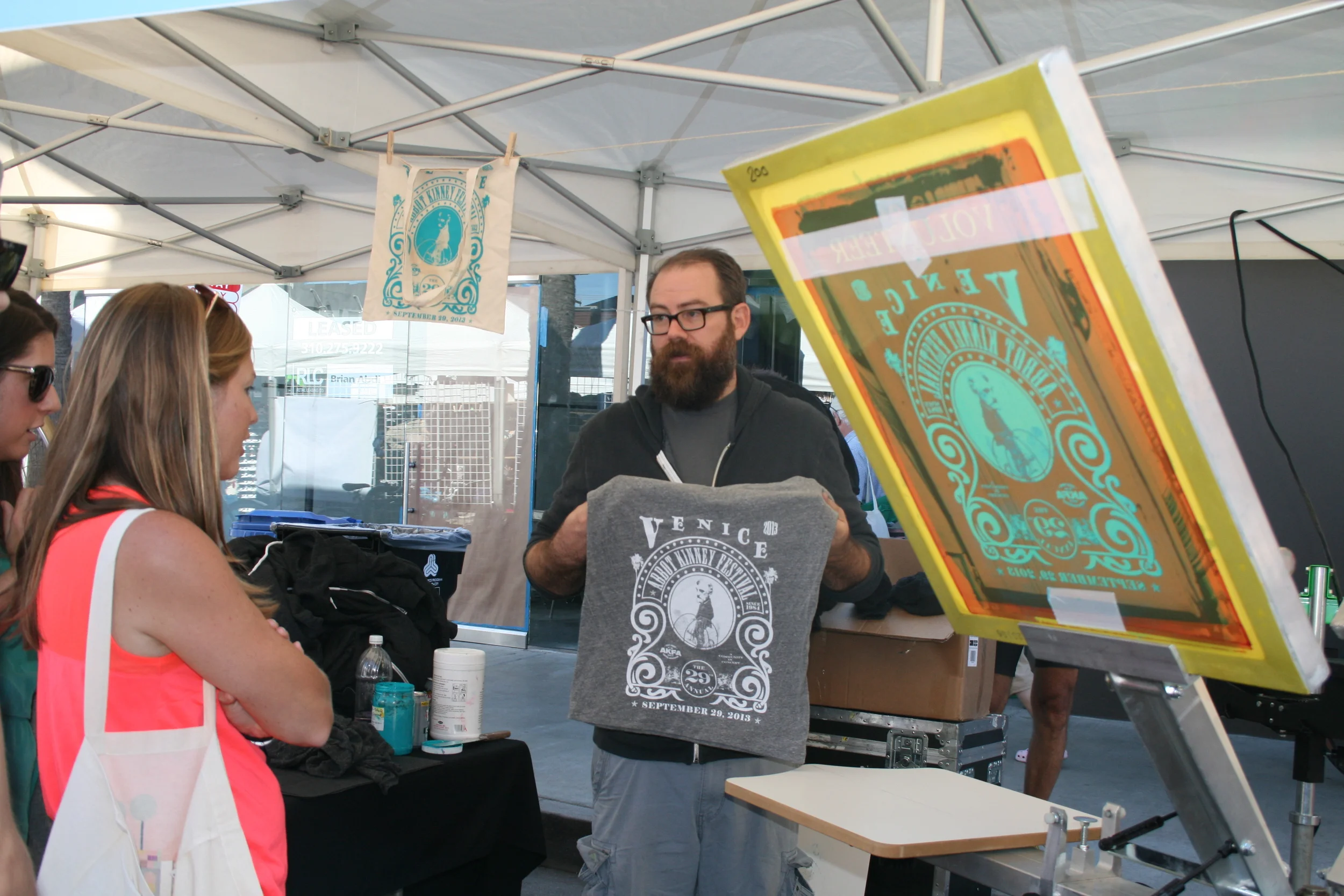  Abbot Kinney Festival merch table with live screen printing. (Photo by Kathy Urso) 