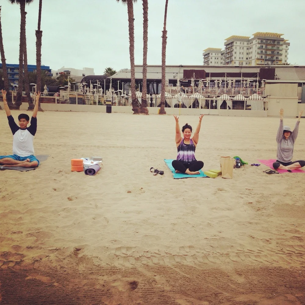 teaching yoga at mothers beach.jpg