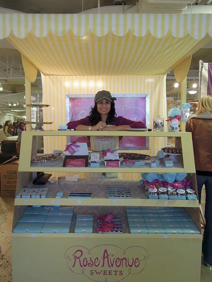 Rose Avenue Sweets booth made with vintage yellow and white striped wallpaper at UniqueLA .