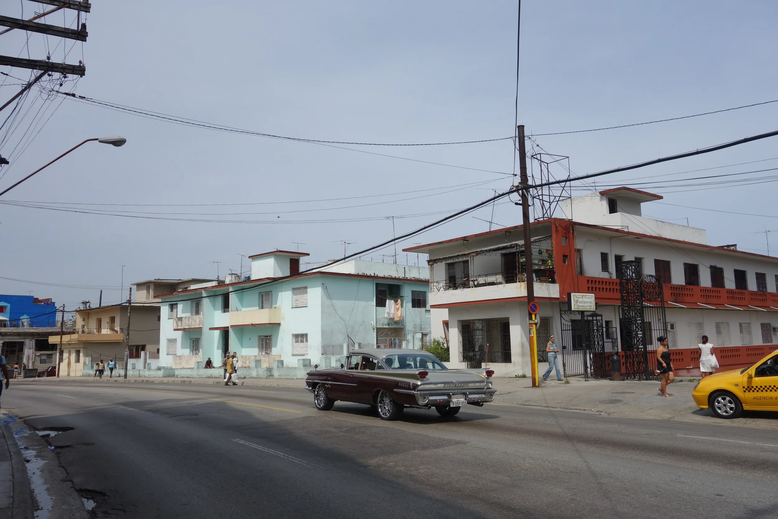  Watching the classics cruise by as we stand outside the Legendario rum factory. 