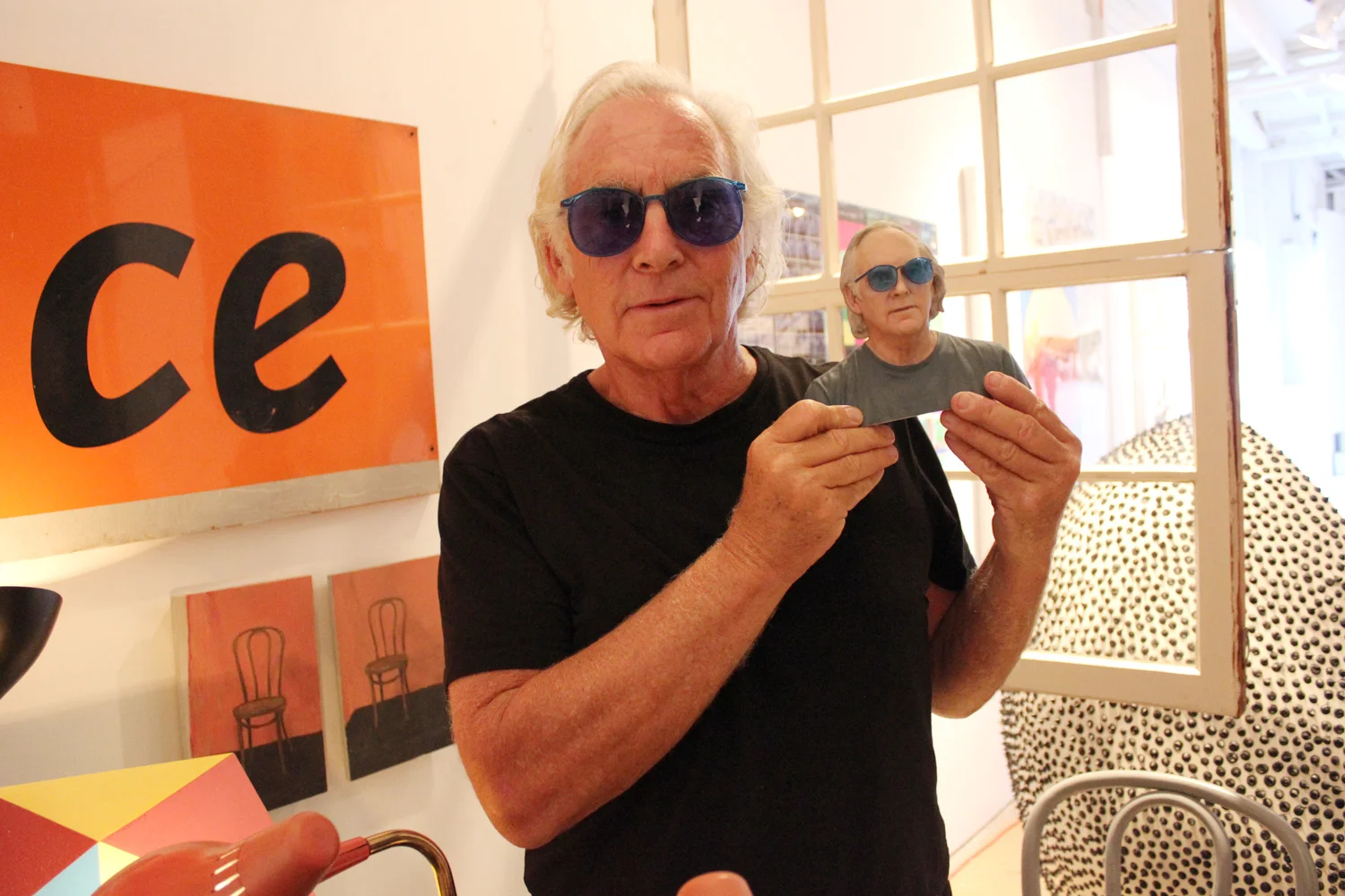  Budman says that his blue sunglasses are a statement of high-low design. "The sunglasses are inexpensive," he says. "Sometimes I give them away." He likes the way they look and likes to see the world in his favorite color. 