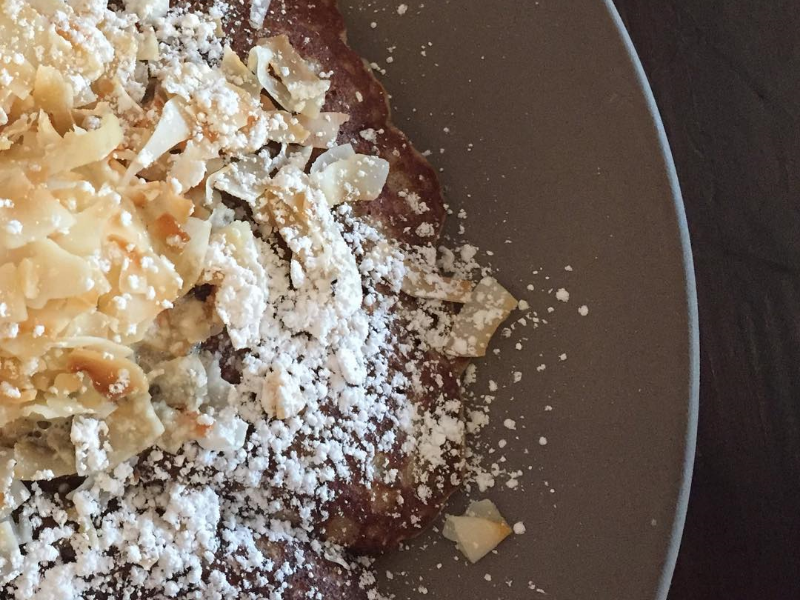 Brown butter pancakes layered under vanilla whipped cream and toasted coconut. ( Photo by Nicole Urso Reed @lincolandrose .)