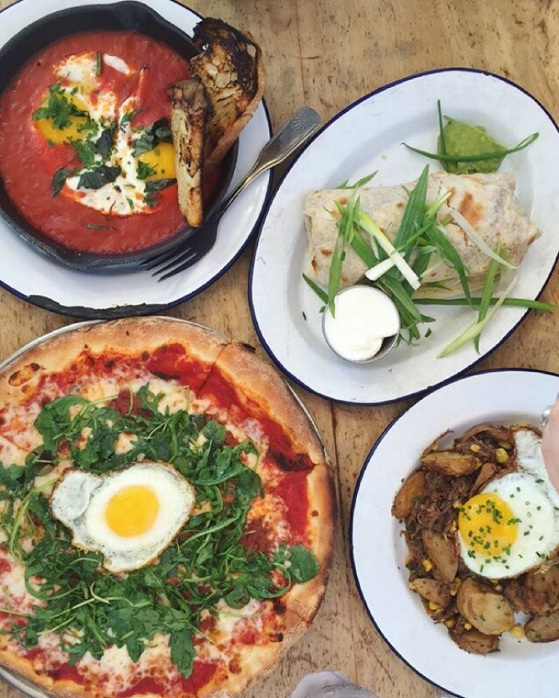 Baked eggs, breakfast burrito, potatoes and pizza with fried-egg toppers. ( Photo by Tye Alfio @tyealfio .)