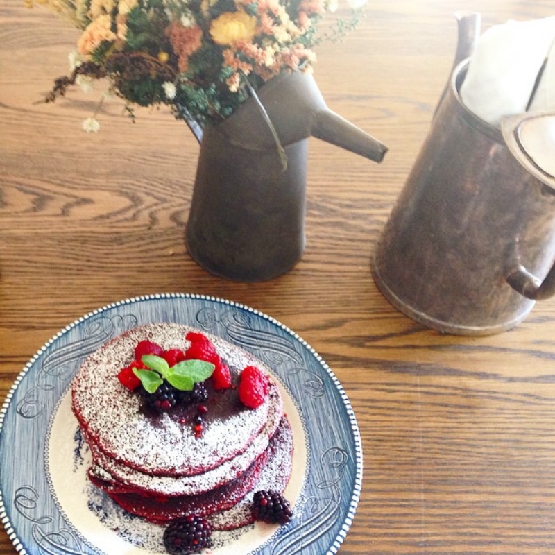Red velvet pancakes with fresh berries. ( Photo by @buttermilkinc . )