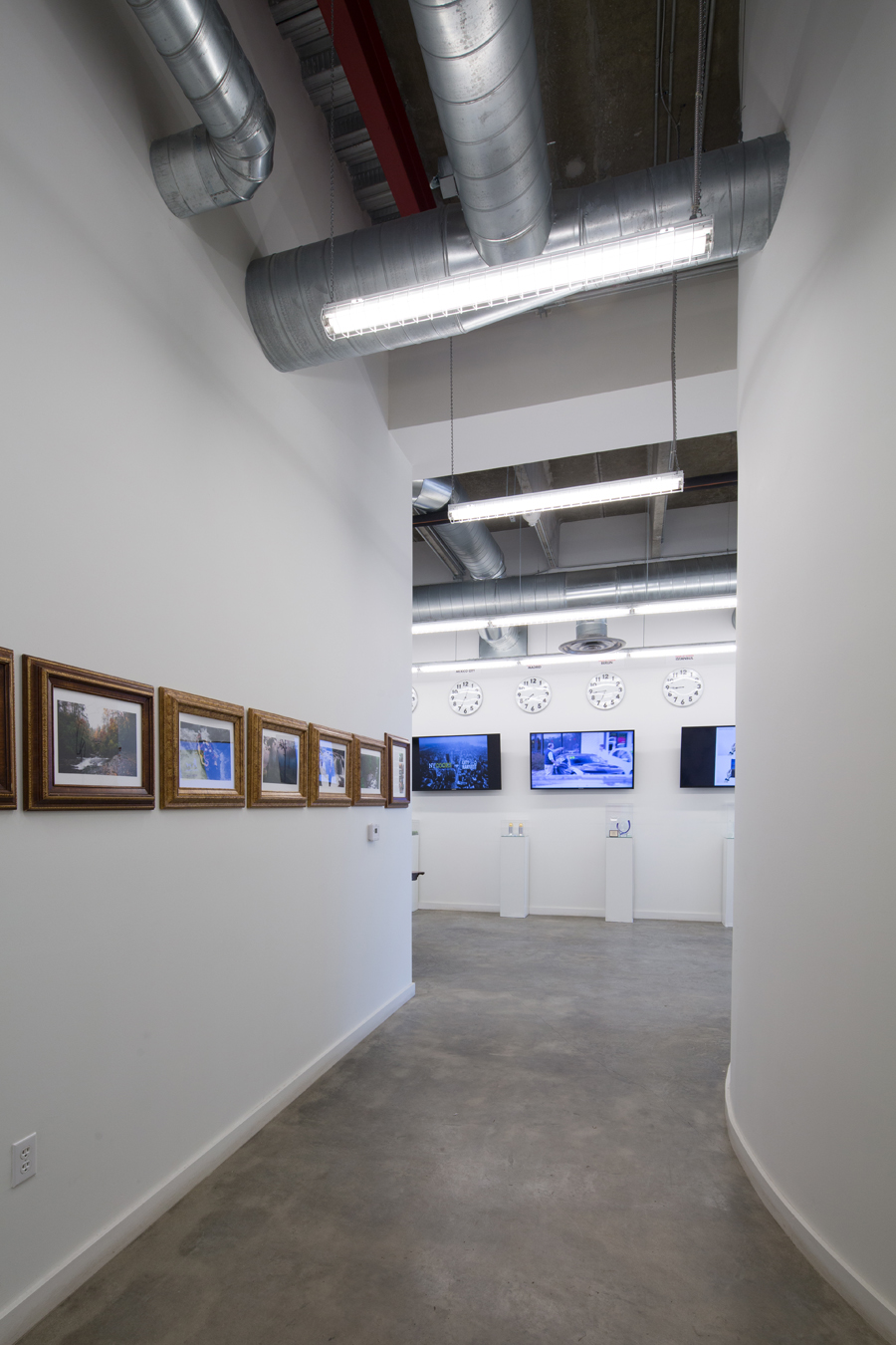  All-white walls are canvasses for examples of student work. 