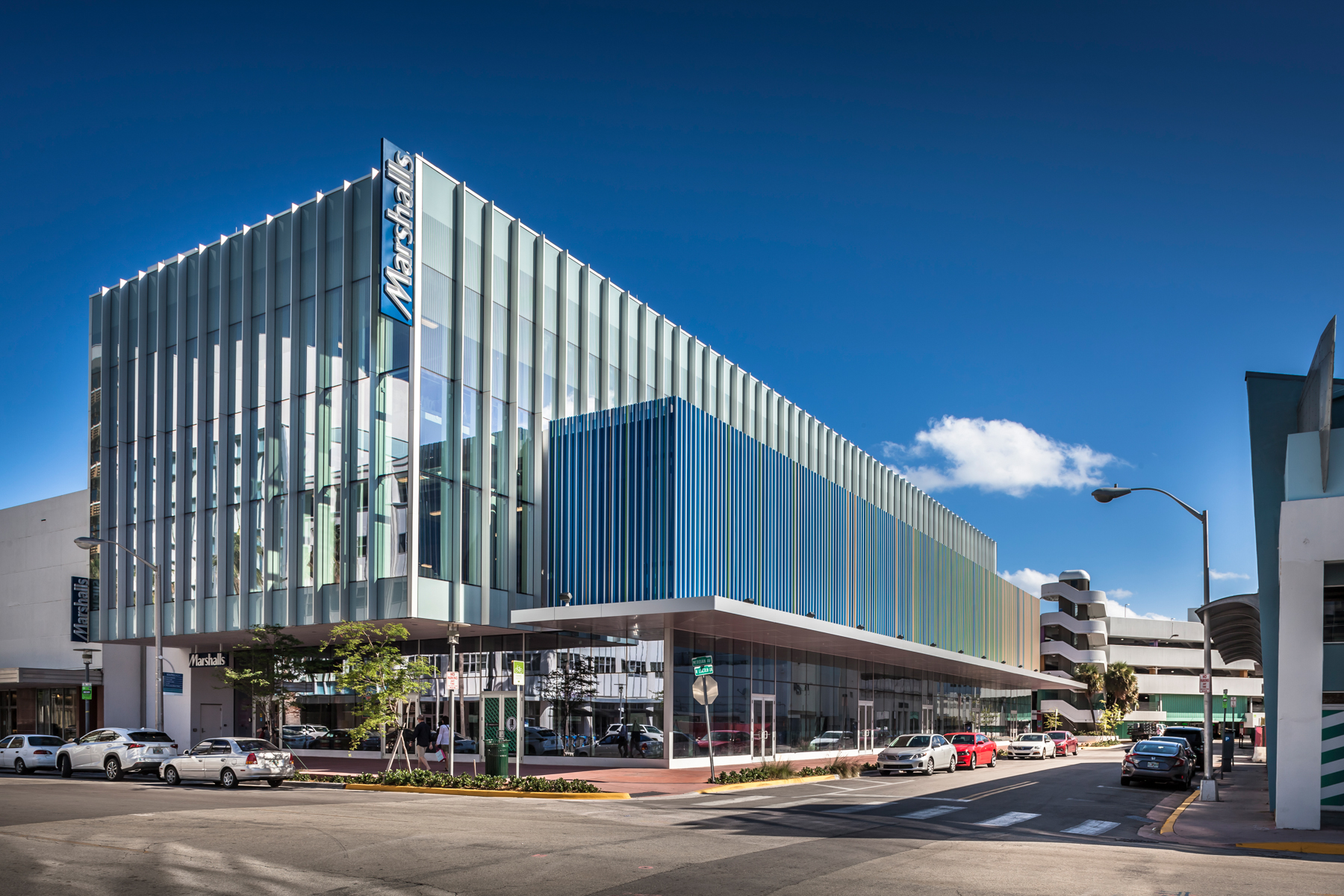  The design offers an elegant solution to the requirements of big-box retail by lifting the flagship retail off the ground, allowing more pedestrian-friendly uses to wrap the ground floor. The design opens the box with abundant glazing and converts t