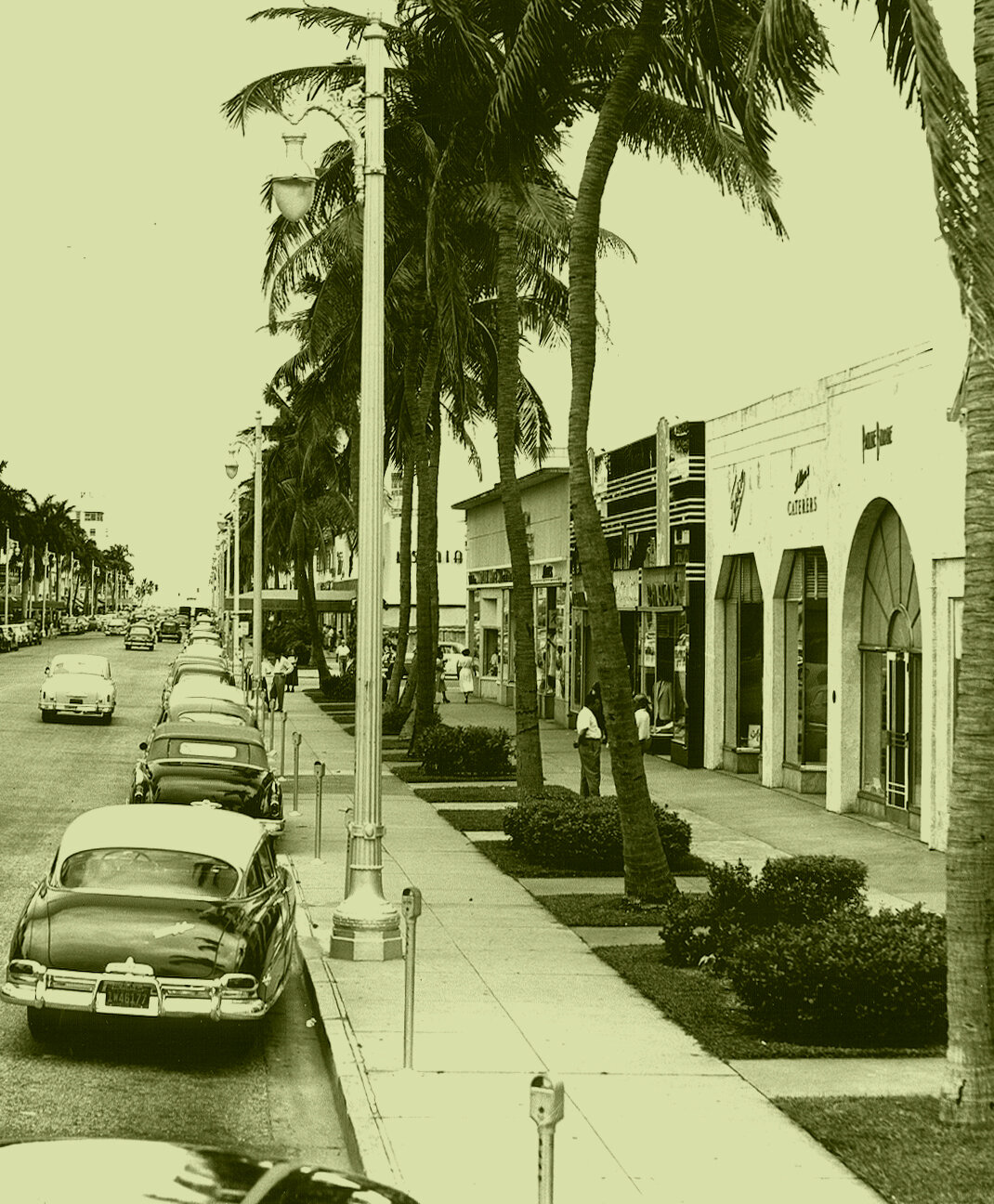  View of Lincoln Road looking East.   730 Lincoln Road was Pauline Budine, a women’s clothing store.   728 Lincoln Road was Allen’s Caterer’s.  Photo circa 1935 – 1956,  courtesy of Historical Museum of Miami  