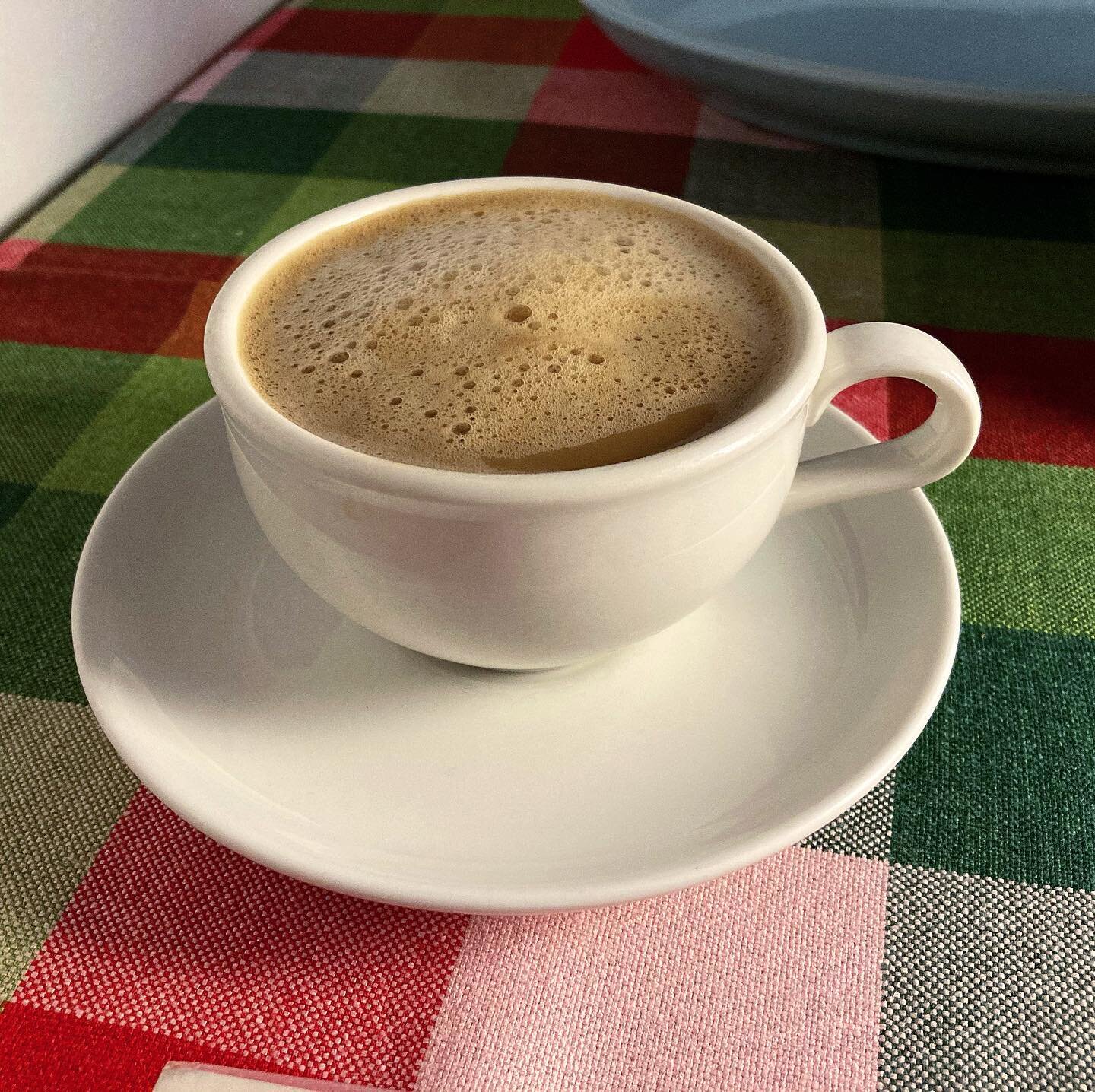 I've had this Russel Wright Iroquois Casual cup and saucer in my cupboard for ages but usually pass it over in favor of using an Iroquois mug or a White Clover cup and saucer. This morning, I used it for the first time. This is a redesign of Wright's