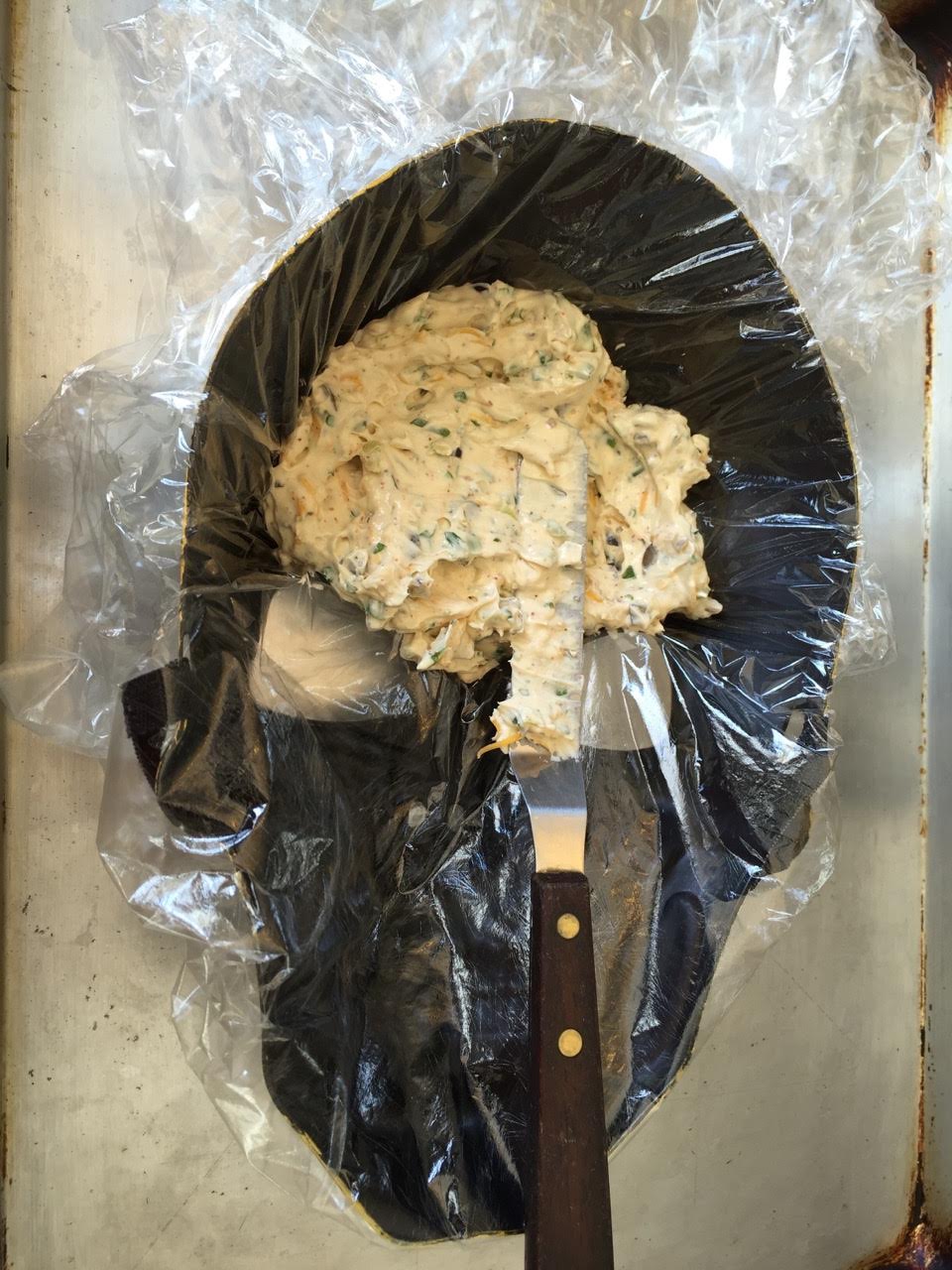 Whip up the cream cheese mixture and press evenly into the mask and chill until firm.