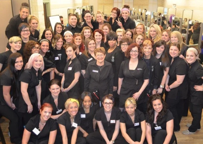 Berni Marcotte, Center, with her team members and students at The Brown Aveda Institute in Mentor, Ohio.