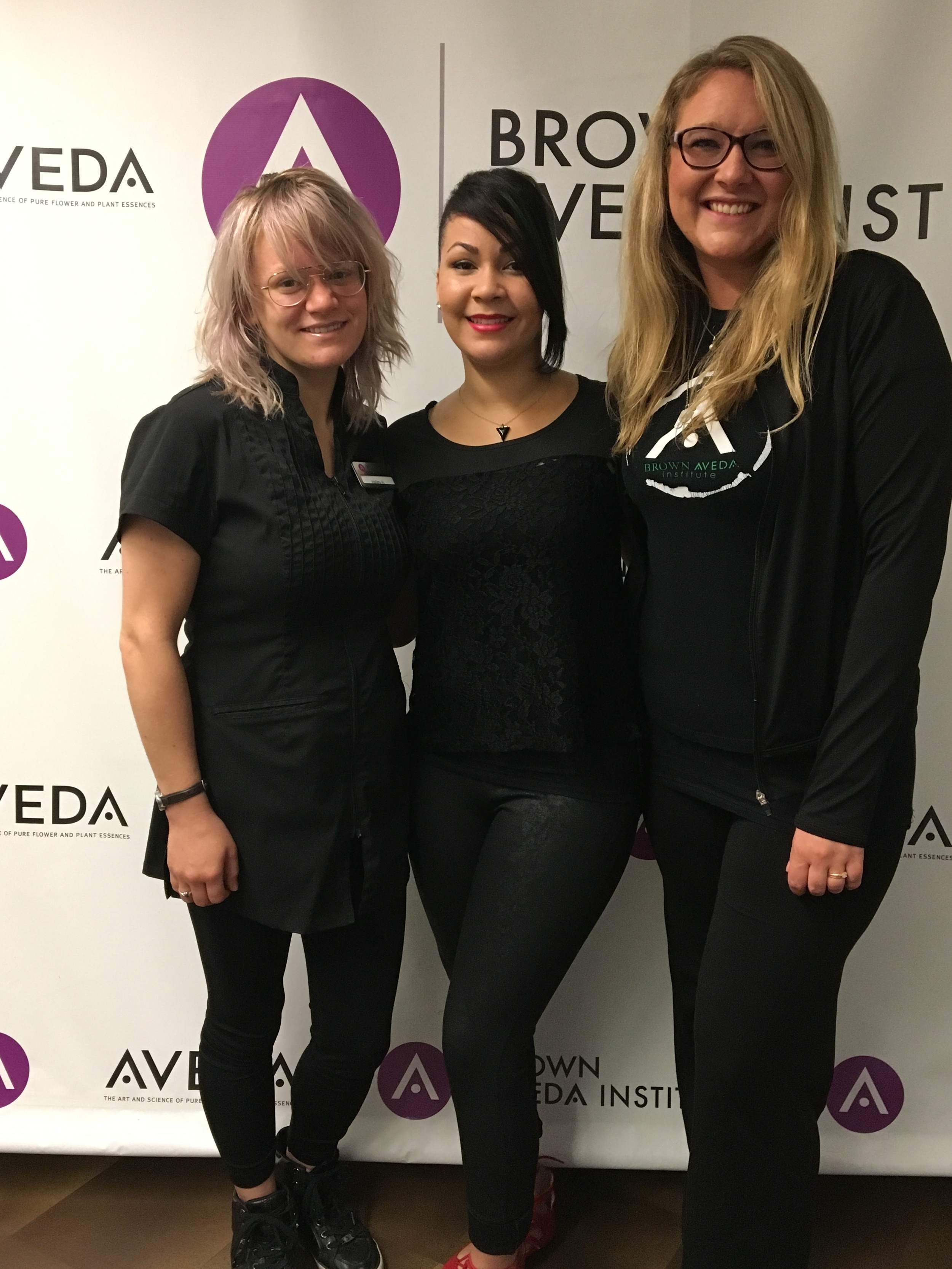 Brown Aveda student Hailey Hughes, educator Rose Marie Benitez, and student Dasha Olecki will be attending AVEDA's Midamerica show on September 30.