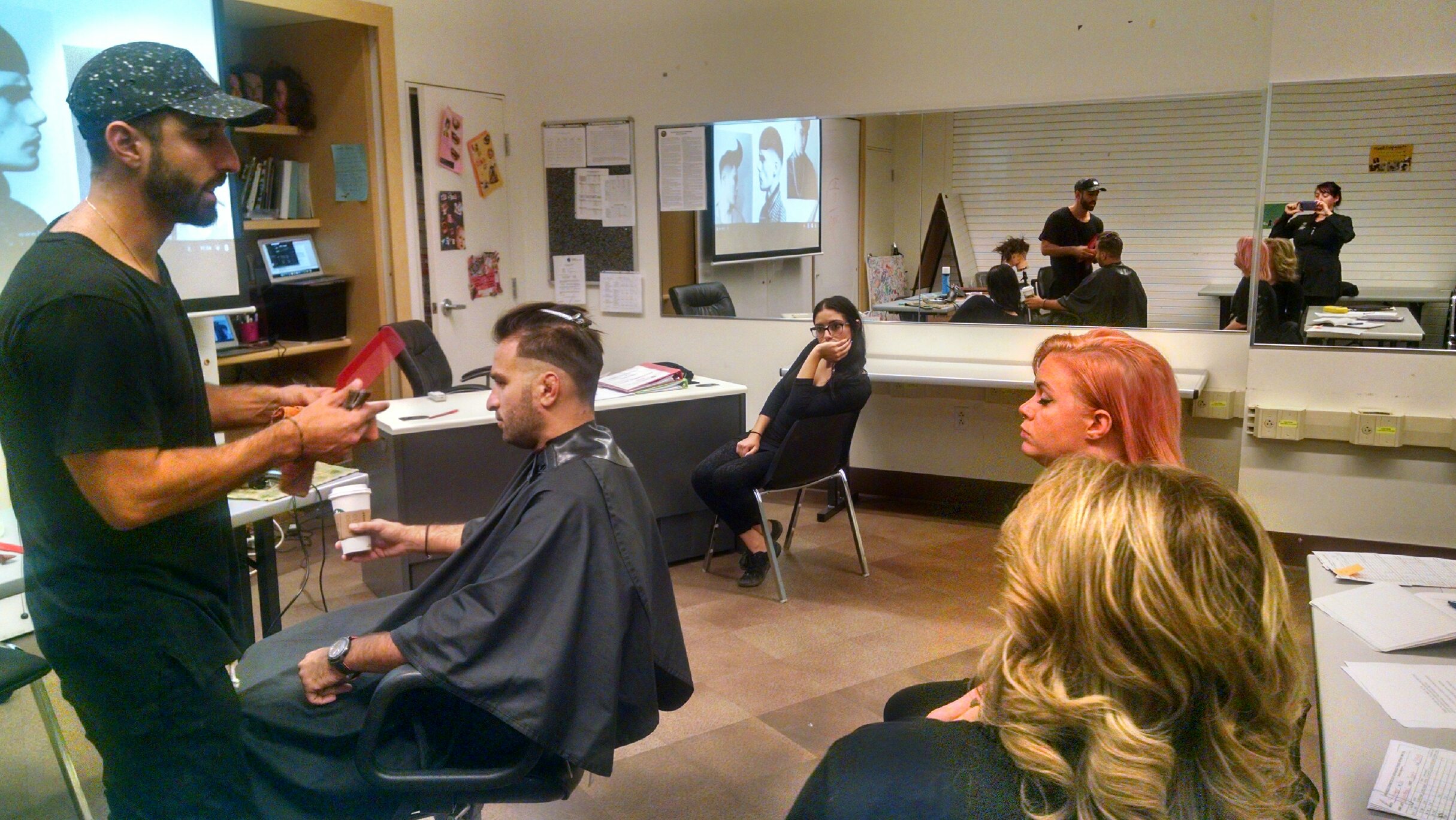Patrick Ina teaching students Jaimie Coffman and Janet Hamel-Smith with fellow Advanced Educator Gabi Kutkut looking on.
