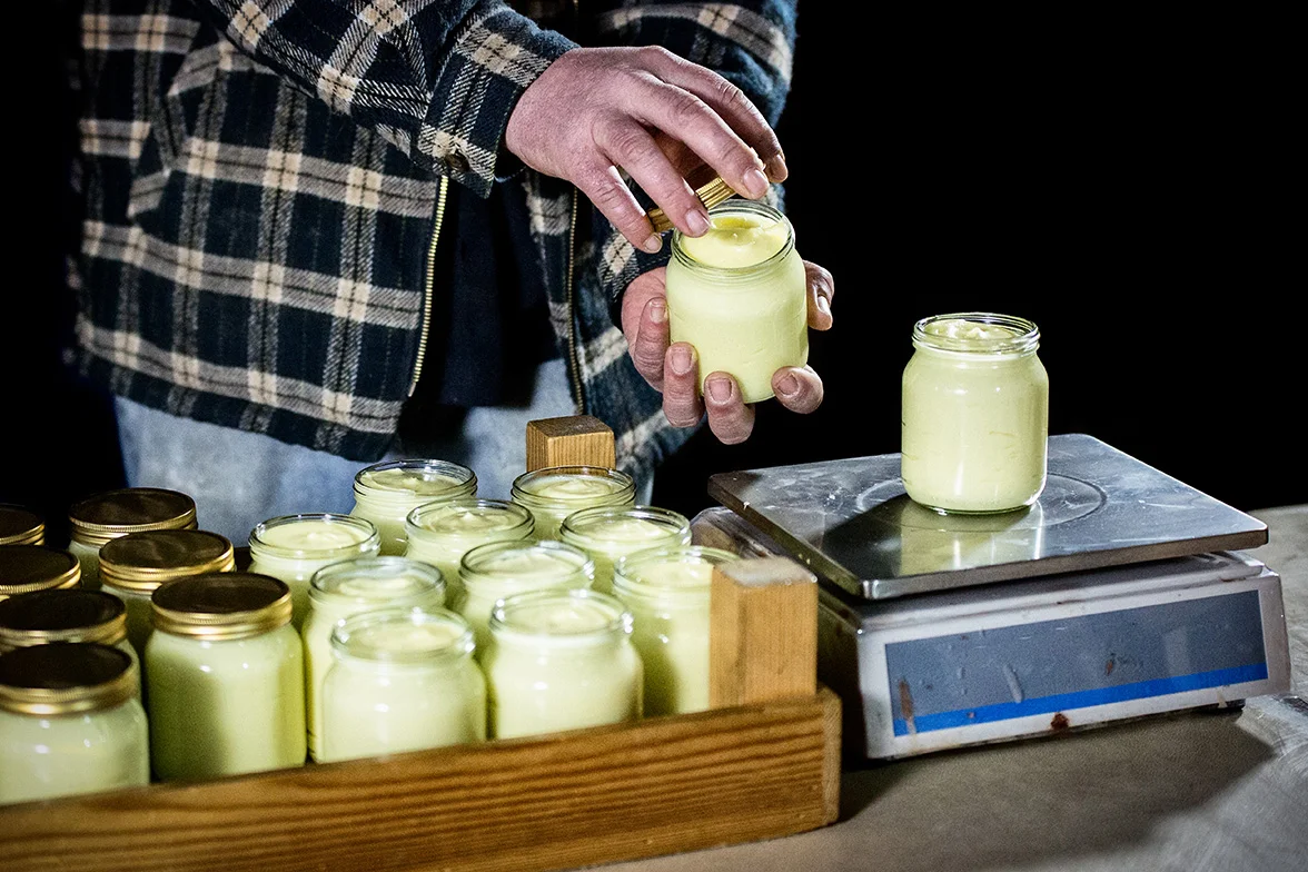 3. Jars are filled, weighed, lidded and labelled, also by hand