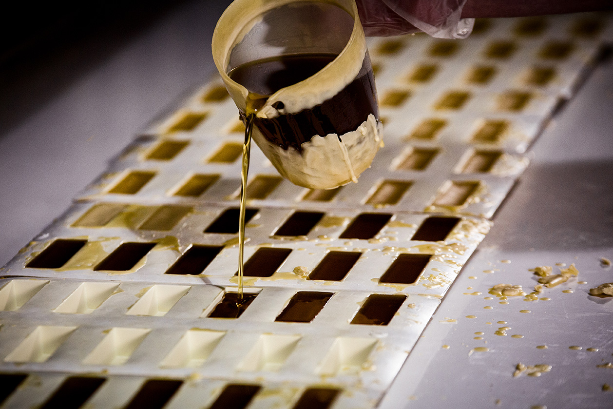 Pouring hot beeswax for beeswax sticks - Cambridge Traditional Products