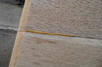 Push a small beeswax "worm" into the split