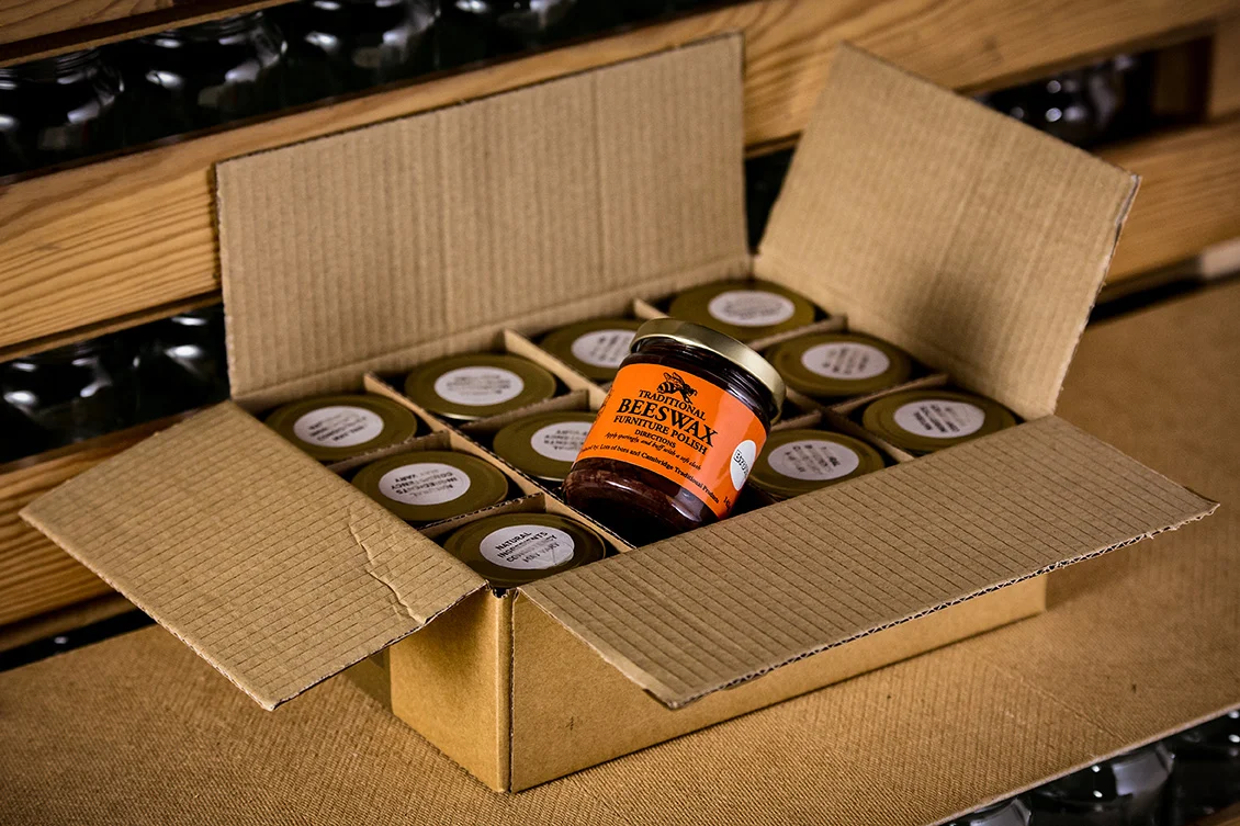 Box of jars of traditional handmade brown beeswax furniture polish - Cambridge Traditional Products