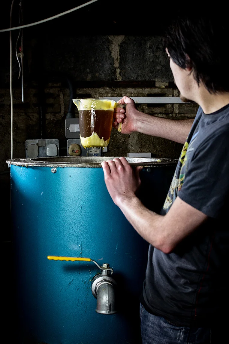Getting jug of hand made beeswax from tank - Cambridge Traditional Products