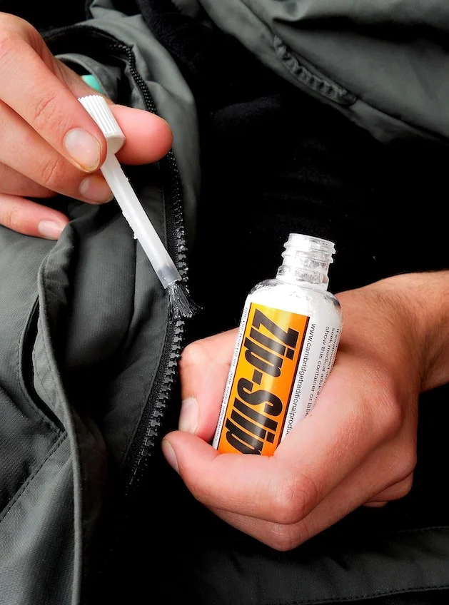 Bottle of Zip-Slip with applicator for zip repairs - Cambridge Traditional Products