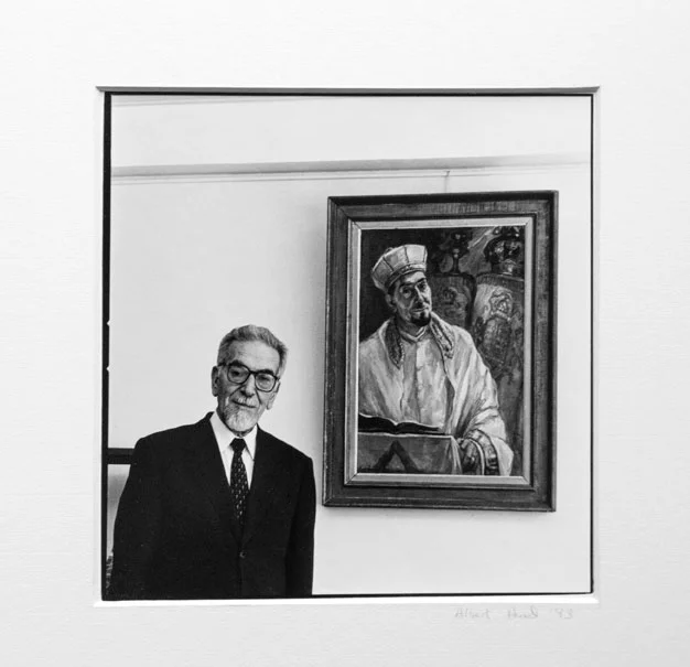 Rabbi in front of his portrait