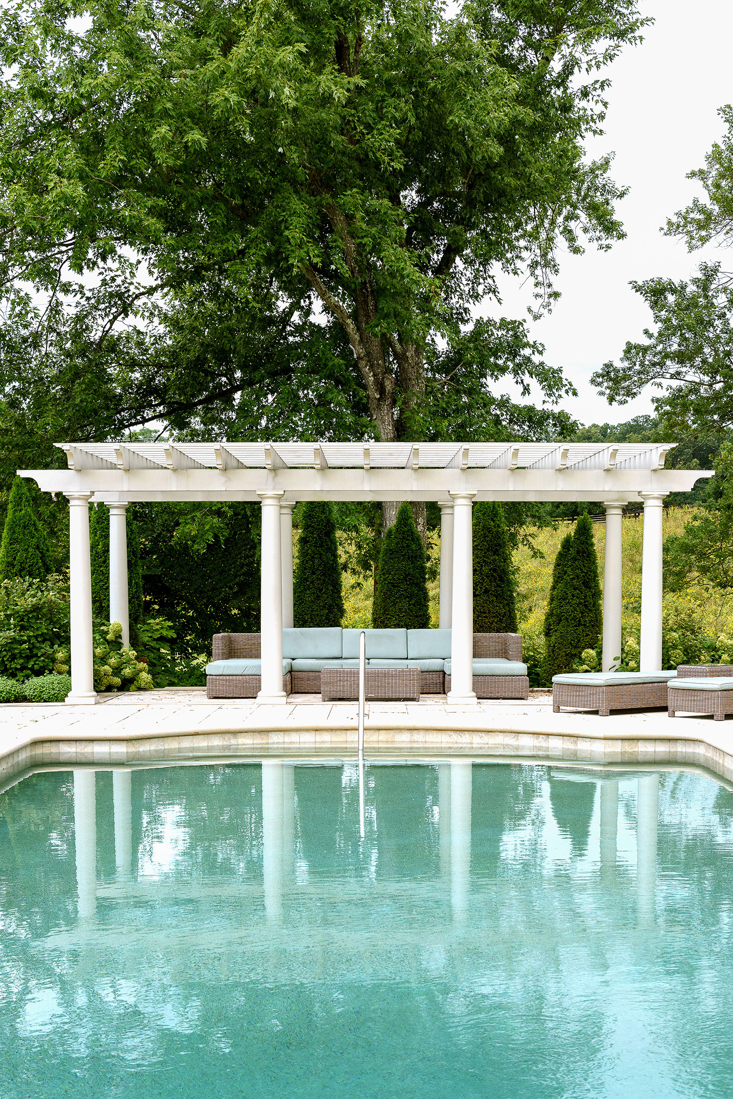Shady_classic_Pool_pergola_limestone_groundedllc_annaboeschenstein.jpg