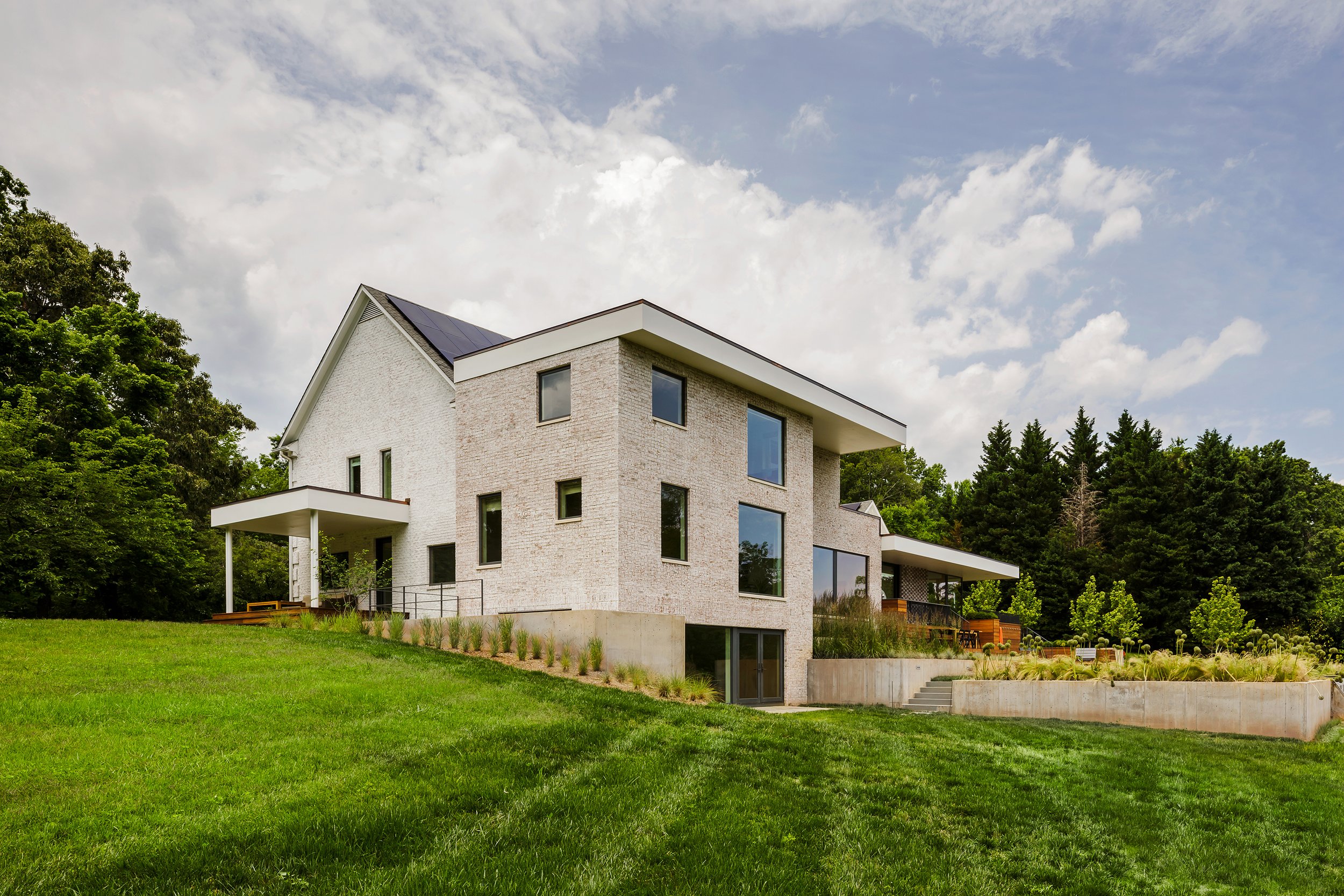 Grounded_modern_landscape_architecture_design_addition_lawn_slope.jpg