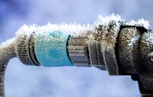 Preventing Frozen Pipes, January 2014: FROZEN PIPES IN SOUTHERN CLIMATES Homebuilders in the South often do not consider the threat of freezing weather and thus place water pipes in vulnerable locations. Houses built on slab foundations, common in the South, frequently have water pipes running through the attic, an especially vulnerable location. In addition, Southern homeowners experience relatively few severe cold spells, so they don't consider freezing a problem and don't bother checking the condition or location of pipes in their homes. In the North, by contrast, homebuilders know freezing is a threat, and they usually do not place water pipes in unheated portions of a building or outside of insulated areas. Southern homeowners should be aware that pipes in attics, crawl spaces and outside walls are all subject to freezing and bursting. If these pipes don't have insulation or heat to protect them, a strong overnight freeze can cause trouble. Homeowners in the South need to be alert to the danger of freezing and bursting water pipes when the outdoor temperature threatens to drop to 20° F. That's the temperature at which ice is likely to start forming in water pipes located in an unheated portion of a house. Once ice forms into a blockage in a pipe, continued growth of ice in the pipe can lead to excessive water pressure. It's pressure of the water that has no place to go when ice builds that causes the pipe to burst, rather than ice pushing against the wall of a pipe. Although 20°F is well below the freezing temperature of water, two factors make this the critical outdoor temperature: 1. The temperature of an unheated portion of a house is almost always at least a few degrees above the outdoor temperature. For example, an insulated attic may be at 37 or 38° F when the outdoor temperature is 32° F. 2. Water "supercools" several degrees below freezing before any ice begins to form. In research tests at the University of Illinois, water pipes placed in an unheated, insulated attic consistently started forming ice when the outdoor temperature dipped just below 20°F. The 20° F threshold is primarily for homes in the South and other areas where freezing may occur only a handful of times each season. There are several precautions homeowners in the South can take when the temperature is expected to dip into the low 20s: •Seal all openings where cold air can get at unprotected water pipes. It's especially important to keep cold wind away from pipes, which speeds up the freezing process. •Leave cabinet doors open under the kitchen and bathroom sinks to allow warmer room air to circulate around pipes. •Let faucets drip slowly to keep water flowing through pipes that are vulnerable to freezing. Ice might still form in the pipes, but an open faucet allows water to escape before the pressure builds to where a pipe can burst. If the dripping stops, it may mean that ice is blocking the pipe; keep the faucet open, since the pipe still needs pressure relief. •Pipes in attics and crawl spaces should be protected with insulation or heat. Pipe insulation is available in fiberglass or foam sleeves. Home centers and hardware stores have sleeves providing 1/8 to 5/8 inches of insulation; specialty dealers have products that provide up to 2 inches of insulation. The extra thickness is worth the price and can save a pipe that would freeze with less insulation. •Heating cables and tapes are effective in freeze protection. Select a heating cable with the UL label and a built-in thermostat that turns the heat on when needed (without a thermostat, the cable has to be plugged in each time and might be forgotten). Follow the manufacturer's instructions closely. •Exterior pipes should be drained or enclosed in 2" fiberglass insulation sleeves. •Pipes leading to the exterior should be shut off and drained at the start of the winter. If these exterior faucets do not have a shut-off valve inside the house, have one installed by a plumber. Most building codes now require homes to have adequate protection for pipes, but many plumbing installers are either not aware of the requirements, or simply disregard them. Additionally, many houses were built before the codes required such protection, and thus remain vulnerable. Article courtesy of the Weather Channel. Source: Institute for Business and Home Safety. IBHS is a national nonprofit initiative of the insurance industry to reduce deaths, injuries, property damage, economic losses and human suffering caused by natural disasters.