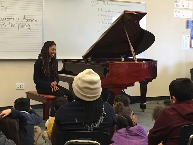Isata talks to the BRAVO students at Rosa Parks Elementary school.