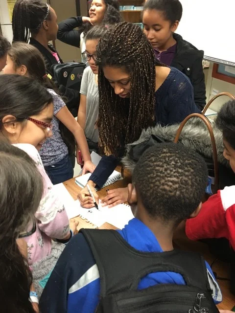 BRAVO Orchestra students from Cesar Chavez School getting Isata’s autograph.