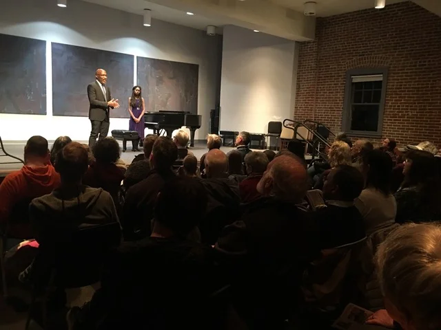 Darrell Grant introduces his new piece at Isata’s performance at the Community Music Center.