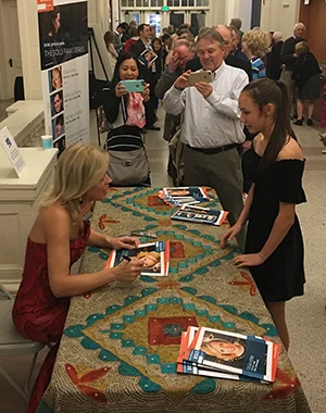Olga greets a young member of the public following her Saturday performance.